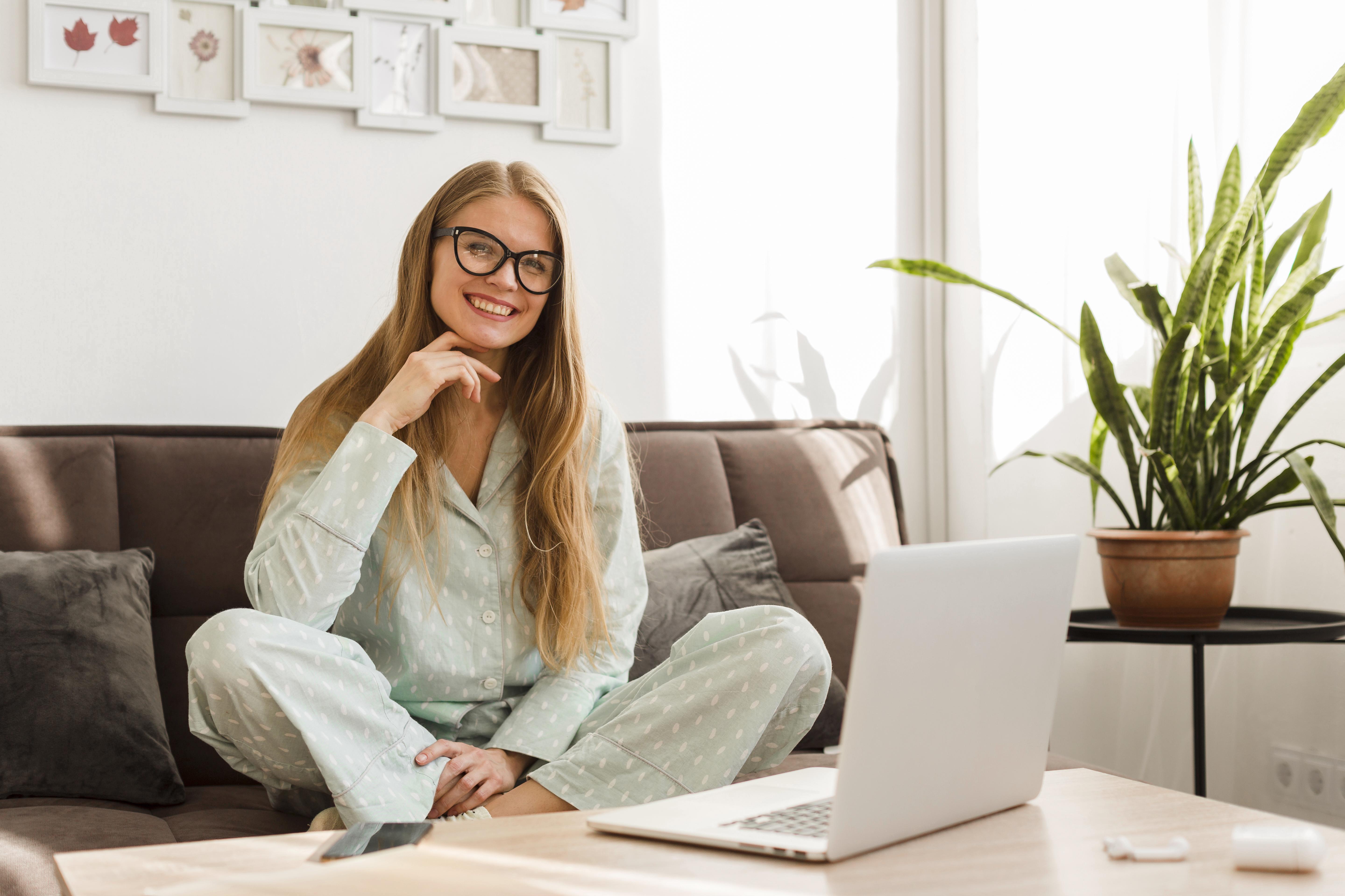 front-view-smiley-woman-pajamas-working-home